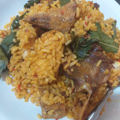 A picture of Native palm oil jollof rice with a twist.