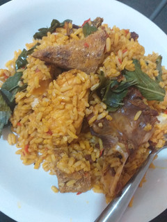 A picture of Native palm oil jollof rice with a twist.