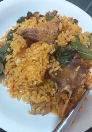 A picture of Native palm oil jollof rice with a twist.
