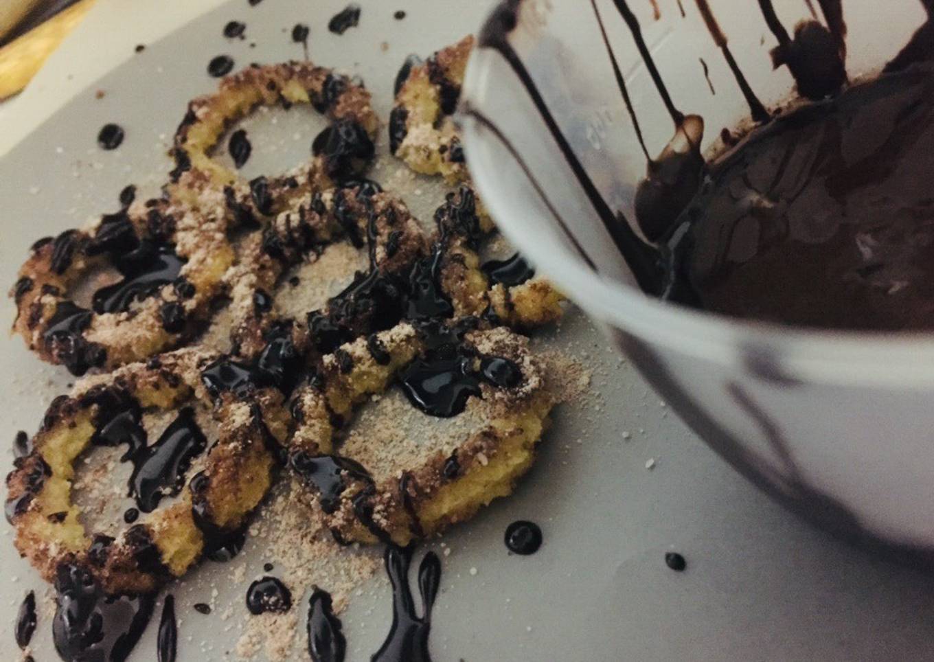 Baked churros with chocolate sauce