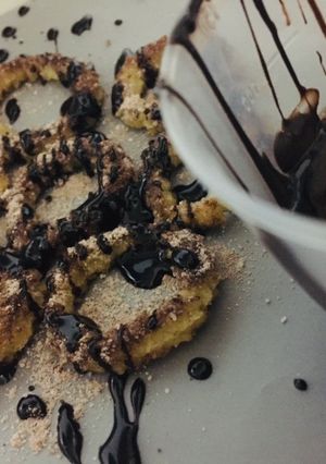 A picture of Baked churros with chocolate sauce.