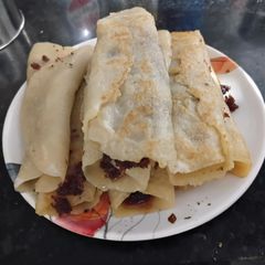 A picture of Sooji(Semolina) Patisapta - Coconut stuffed Bengali style.