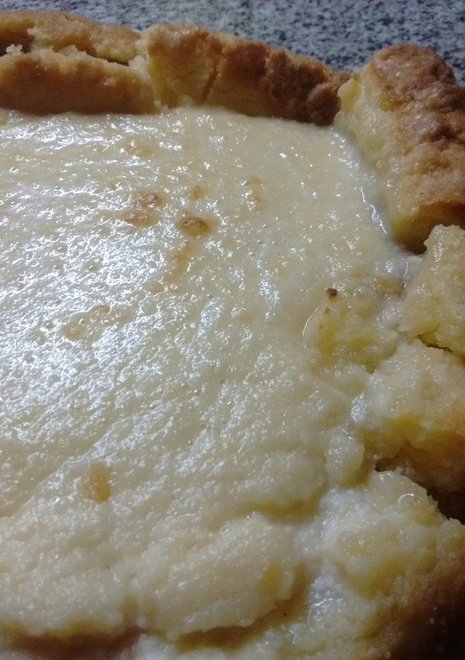 Una foto de Tarta de ricota con base de dulce de leche