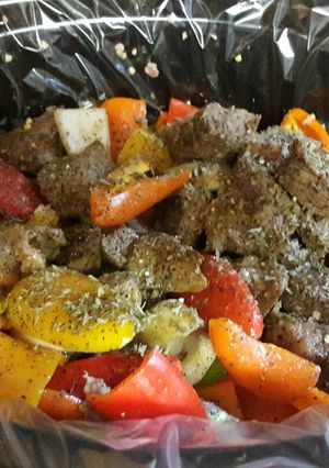 A picture of Beef tips with onions and sweet peppers.