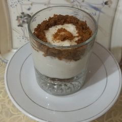 A picture of Firni pudding with candy bite.