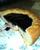 Pastel de queso con mermelada de arándanos