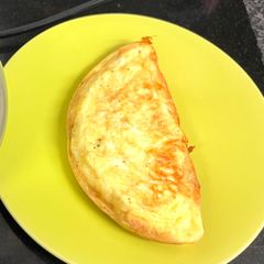 A picture of Cheese Omelette in an Omelette Maker.