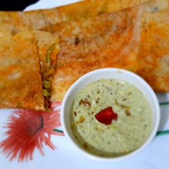 A picture of Stuffed Rava Dosa with shezwan twist.