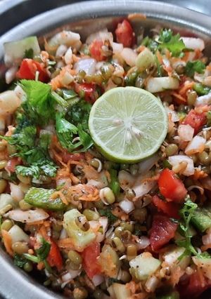 A picture of Whole Green Moong sprouts vegetables salad.