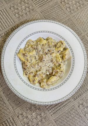 O poză a rețetei Tortellini cu prosciutto și hribi.