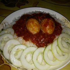 A picture of White rice and stew.