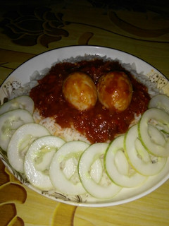 A picture of White rice and stew.