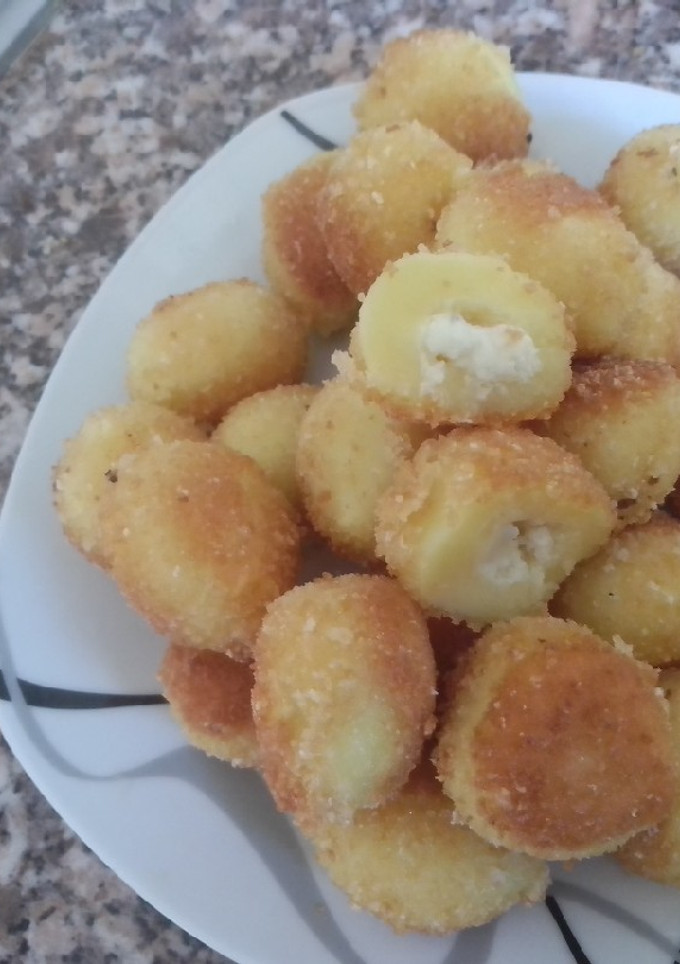 Una foto de Ñoquis de queso rebozados