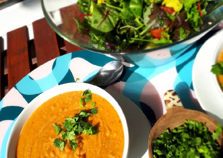 Spicy red lentil soup with onion and coriander