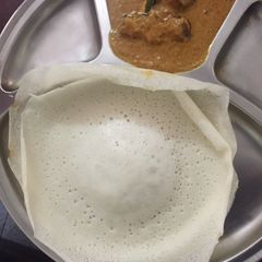 A picture of Appam with mutton leg curry(ATTUKAL PAYA).
