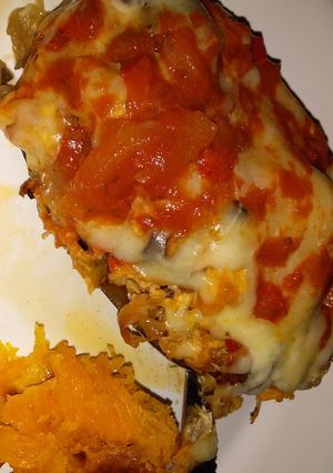 Una foto de Berenjena rellena de pollo a la napolitana