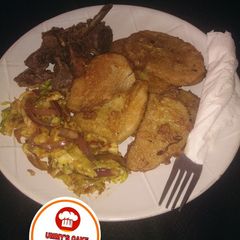 A picture of Fried yam & Egg wif cabbage sauce.