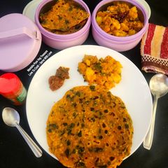 A picture of Methi Thepla With Til Jeera Aloo Sabzi - A perfect Meal for Traveling Tiffin - Picnic Potluck.