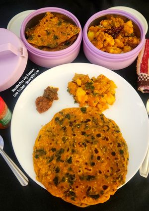 A picture of Methi Thepla With Til Jeera Aloo Sabzi - A perfect Meal for Traveling Tiffin - Picnic Potluck.