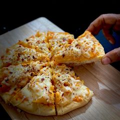 A picture of Veg Pasta Pizza.