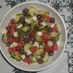 A picture of Tomato and Cucumber salad.