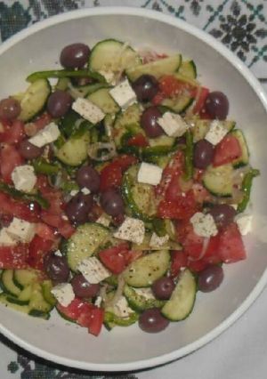 A picture of Tomato and Cucumber salad.