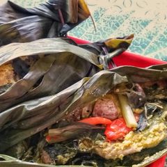 A picture of Pepes Ayam / Indonesian Steamed Chicken in Banana Leaf.