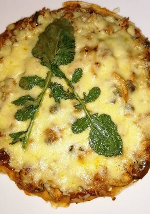 A picture of Stove Top Chicken Tikka Pizza.