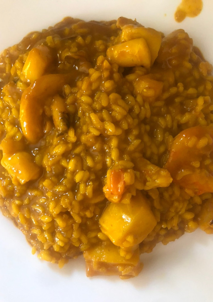 Una foto de Arroz meloso de sepia y gambones