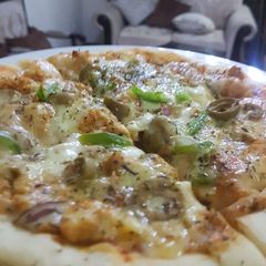 Chicken tikka pizza A picture of Chicken tikka pizza.