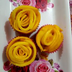 A picture of Mango flower cup cakes.