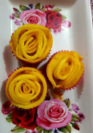 A picture of Mango flower cup cakes.