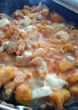 Una foto de Ñoquis de kabutia con salsa roja