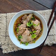 A picture of 144. Steamed Garlic Chicken with Ginger & Crispy Garlic Topping.