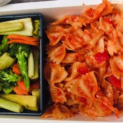A picture of Pasta with cheese-tomato herb sauce & stir fry vegetables.