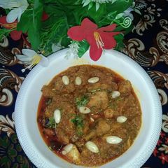 A picture of Chicken badami karahi.