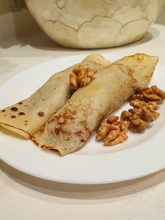 Una foto de Panqueques con dulce de leche y nuez