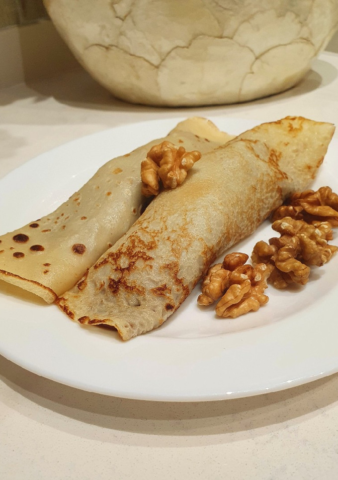 Una foto de Panqueques con dulce de leche y nuez