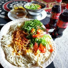 A picture of Native spaghetti with palm oil.