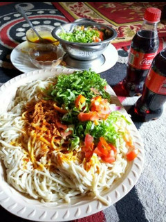 A picture of Native spaghetti with palm oil.