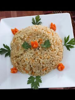 صورة لوصفة كُسكُس مفلفل مع شعيرية