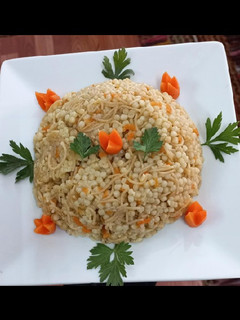 صورة لوصفة كُسكُس مفلفل مع شعيرية