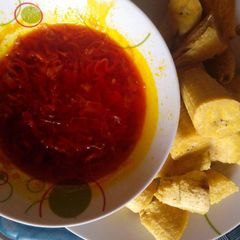 Boiled plantain with palmoil with fresh pepper A picture of Boiled plantain with palmoil with fresh pepper.