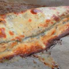 Foto principal de Merluza rellena de tortilla de cebolla gratinada con mahonesa