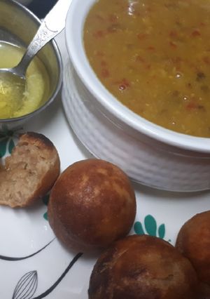 A picture of Dal baatis in appe pan.