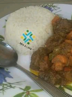 A picture of White rice and curry stew.