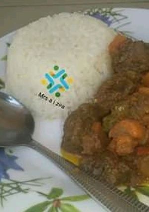 A picture of White rice and curry stew.