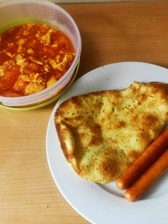A picture of Fried  Eggs with tomatoes.