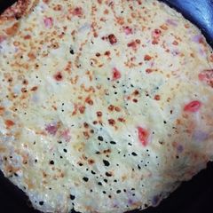 Onion tomato rava dosa A picture of Onion tomato rava dosa.