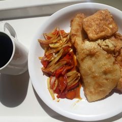 Yamarita with oniontomatoe sauce and black tea A picture of Yamarita with oniontomatoe sauce and black tea.